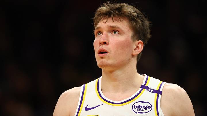 Nov 26, 2024; Phoenix, Arizona, USA; Los Angeles Lakers guard Dalton Knecht (4) against the Phoenix Suns during an NBA Cup game at Footprint Center. Mandatory Credit: Mark J. Rebilas-Imagn Images