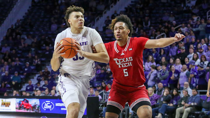 Jan 14, 2025; Manhattan, Kansas, USA; Kansas State Wildcats forward Coleman Hawkins (33) is guarded by Texas Tech Red Raiders forward Darrion Williams (5) during the first half at Bramlage Coliseum. Mandatory Credit: Scott Sewell-Imagn Images Jan 14, 2025; Manhattan, Kansas, USA; Kansas State Wildcats forward Coleman Hawkins (33) is guarded by Texas Tech Red Raiders forward Darrion Williams (5) during the first half at Bramlage Coliseum. Mandatory Credit: Scott Sewell-Imagn Images