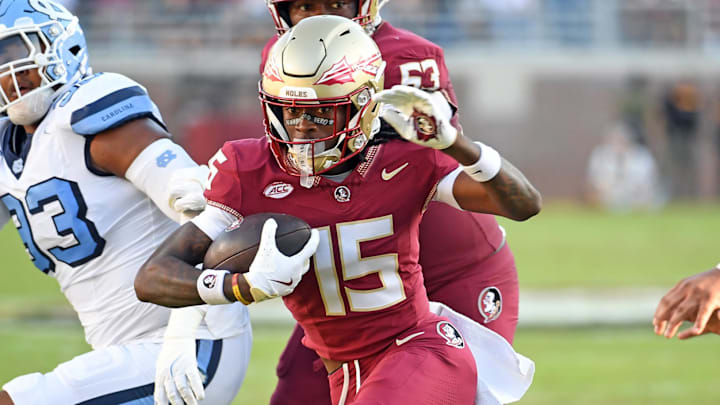 Nov 2, 2024; Tallahassee, Florida, USA;  Florida State Seminoes receiver Lawayne McCoy (15) runs the ball for a two point conversion against the North Carolina Tarheels in the first quarter at Doak S. Campbell Stadium. Mandatory Credit: Robert Myers-Imagn Images