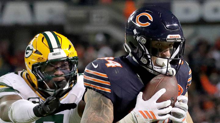 Chicago Bears tight end Colston Loveland catches a pass in front of Packers linebacker Quay Walker during the wild-card game.