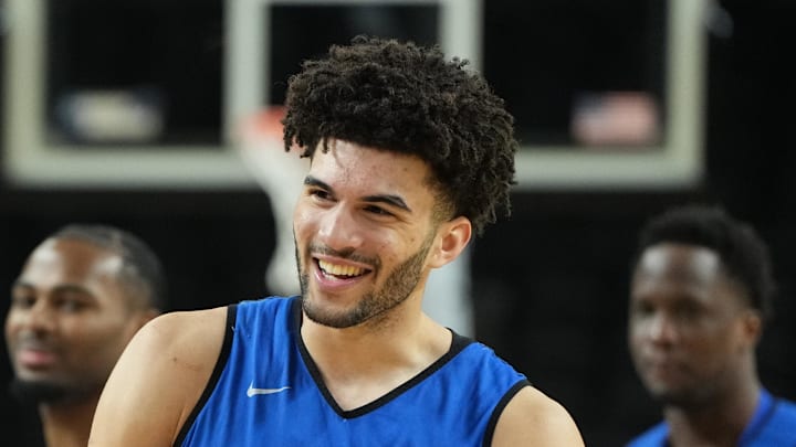 Mar 18, 2026; Greenville, SC, USA; Duke Blue Devils forward Cameron Boozer (12) reacts with forward Maliq Brown (6) during a practice session ahead of the first round of the men's 2026 NCAA Tournament at Bon Secours Wellness Arena. Mandatory Credit: Bob Donnan-Imagn Images