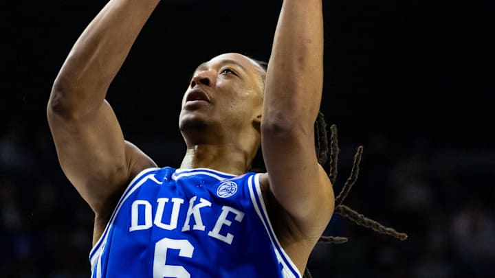 Feb 24, 2026; South Bend, Indiana, USA; Duke Blue Devils forward Maliq Brown (6) drives as Notre Dame Fighting Irish forward Ryder Frost (7) defends during the second half at Purcell Pavilion at the Joyce Center. Mandatory Credit: Michael Caterina-Imagn Images