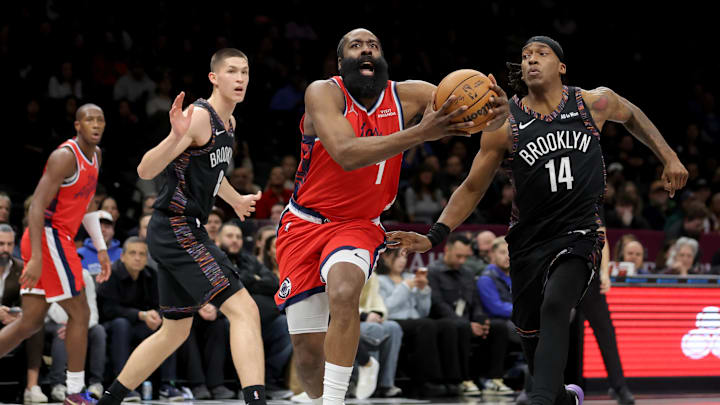Jan 9, 2026; Brooklyn, New York, USA; Los Angeles Clippers guard James Harden (1) drives to the basket against Brooklyn Nets guards Egor Demin (8) and Terance Mann (14) during the first quarter at Barclays Center. Mandatory Credit: Brad Penner-Imagn Images
