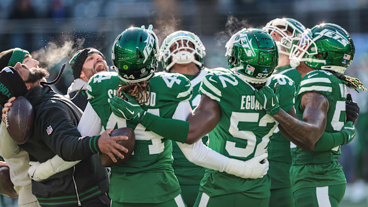 Dec 22, 2024; East Rutherford, New Jersey, USA; New York Jets linebacker Jamien Sherwood (44) huddle with teammates before the game against the Los Angeles Rams at MetLife Stadium. Mandatory Credit: Vincent Carchietta-Imagn Images