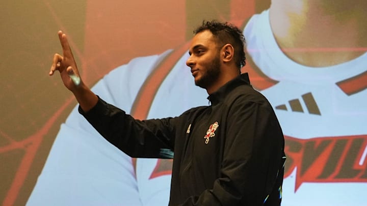 Louisville center Aly Khalifa walks towards the stage as they're introduced at the men's basketball luncheon Monday afternoon at The Galt House hotel. Oct. 7, 2024