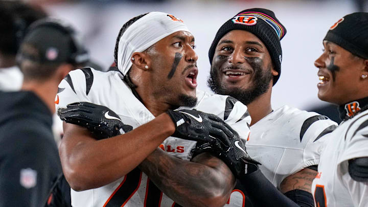 Cincinnati Bengals cornerback DJ Turner II (20) celebrates an interception on the sideline in the second quarter of the NFL Week 7 game between the Cincinnati Bengals and the Pittsburgh Steelers at Paycor Stadium in downtown Cincinnati on Thursday, Oct. 16, 2025.