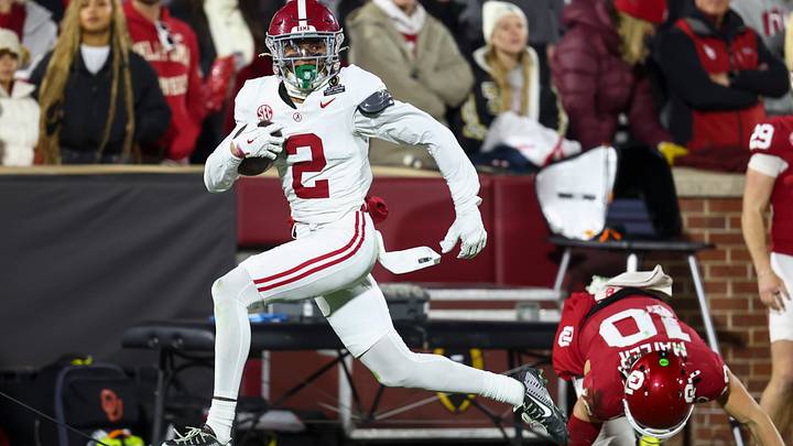 Alabama Crimson Tide defensive back Zabien Brown eludes a tackle by Oklahoma Sooners quarterback John Mateer. Alabama Crimson Tide defensive back Zabien Brown eludes a tackle by Oklahoma Sooners quarterback John Mateer.