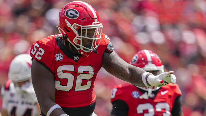 Georgia Bulldogs defensive tackle Christen Miller reacts after making a tackle against the Ball State Cardinals. Georgia Bulldogs defensive tackle Christen Miller reacts after making a tackle against the Ball State Cardinals.