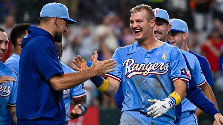 Sep 1, 2024; Arlington, Texas, USA; Texas Rangers third baseman Josh Jung (right) celebrates with starting pitcher Nathan Eovaldi (left) after Jung hits a game winning three run walk-off home run during the tenth inning against the Oakland Athletics at Globe Life Field. Mandatory Credit: Jerome Miron-USA TODAY Sports Sep 1, 2024; Arlington, Texas, USA; Texas Rangers third baseman Josh Jung (right) celebrates with starting pitcher Nathan Eovaldi (left) after Jung hits a game winning three run walk-off home run during the tenth inning against the Oakland Athletics at Globe Life Field. Mandatory Credit: Jerome Miron-USA TODAY Sports