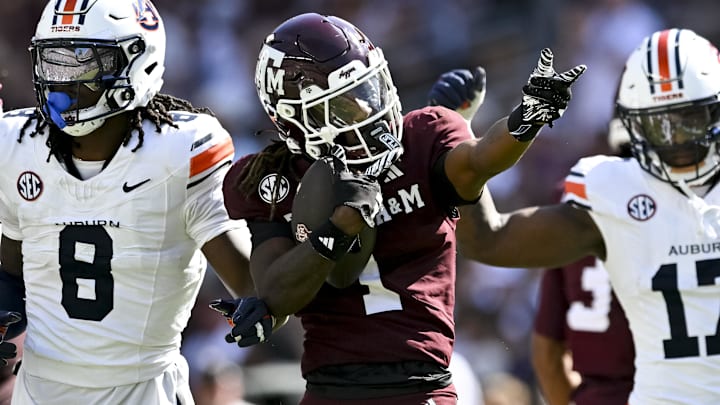 Sep 27, 2025; College Station, Texas, USA; Texas A&M Aggies wide receiver Mario Craver (1) motions against the Auburn Tigers during the first half at Kyle Field. Mandatory Credit: Maria Lysaker-Imagn Images 