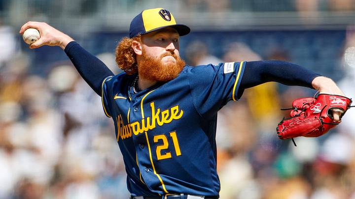 Milwaukee Brewers starting pitcher Dustin May (21) throws a pitch