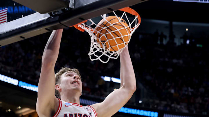 Mar 23, 2024; Salt Lake City, UT, USA; Arizona Wildcats center Motiejus Krivas (14) dunks against Dayton Flyers guard Enoch Cheeks (6) during the first half in the second round of the 2024 NCAA Tournament at Vivint Smart Home Arena-Delta Center. Mandatory Credit: Rob Gray-Imagn Images