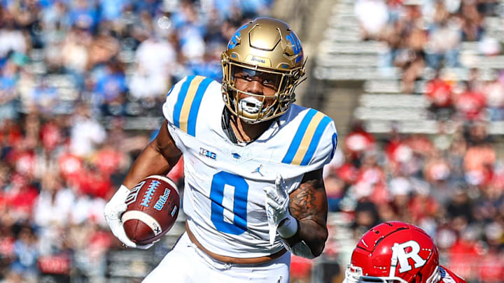 Oct 19, 2024; Piscataway, New Jersey, USA; UCLA Bruins running back Jalen Berger (0) catches a pass for a touchdown as Rutgers Scarlet Knights linebacker Abram Wright (11) pursues during the second half at SHI Stadium. Mandatory Credit: Vincent Carchietta-Imagn Images Oct 19, 2024; Piscataway, New Jersey, USA; UCLA Bruins running back Jalen Berger (0) catches a pass for a touchdown as Rutgers Scarlet Knights linebacker Abram Wright (11) pursues during the second half at SHI Stadium. Mandatory Credit: Vincent Carchietta-Imagn Images