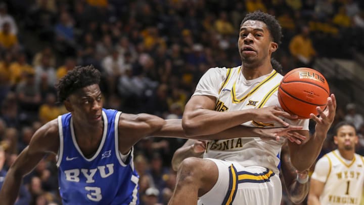 Feb 28, 2026; Morgantown, West Virginia, USA; West Virginia Mountaineers forward DJ Thomas (5) grabs a rebound during the second half against the BYU Cougars at Hope Coliseum. Mandatory Credit: Ben Queen-Imagn Images Feb 28, 2026; Morgantown, West Virginia, USA; West Virginia Mountaineers forward DJ Thomas (5) grabs a rebound during the second half against the BYU Cougars at Hope Coliseum. Mandatory Credit: Ben Queen-Imagn Images