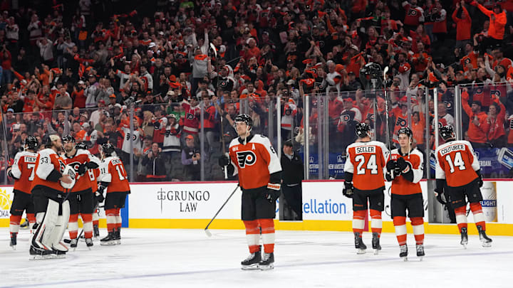 May 9, 2026; Philadelphia, Pennsylvania, USA; The Philadelphia Flyers react to the fans after losing to the Carolina Hurricanes in game four of the second round of the 2026 Stanely Cup Playoffs at Xfinity Mobile Arena. Mandatory Credit: James Lang-Imagn Images