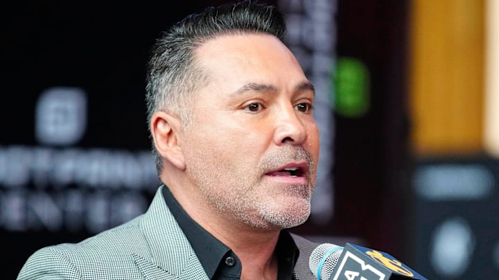 Jan. 25, 2024; Phoenix, Ariz; USA; Oscar De La Hoya speaks about boxer Jamie Munguia (center) about the Munguia v Ryder main event during a press conference for Golden Boy boxing event.
