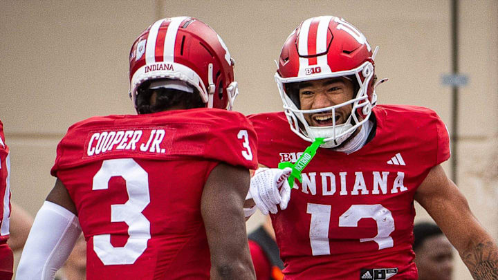 Indiana's Elijah Sarratt (13) and Omar Cooper Jr. (3) celebrate a touchdown at Memorial Stadium.