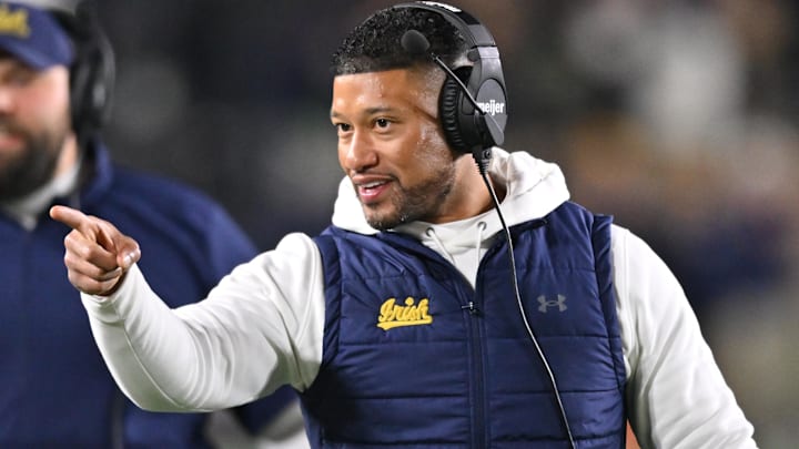 Notre Dame football coach Marcus Freeman reacts to a play on the sidelines. Notre Dame football coach Marcus Freeman reacts to a play on the sidelines.