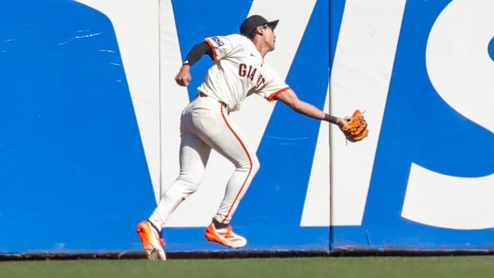 Apr 4, 2025; San Francisco, California, USA; San Francisco Giants outfielder Jung Hoo Lee (51) makes a catch in the outfield during the seventh inning against the Seattle Mariners at Oracle Park.