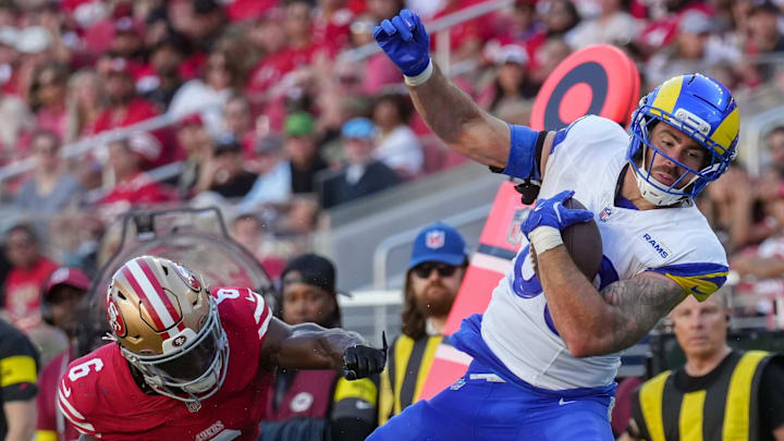 Nov 9, 2025; Santa Clara, California, USA; Los Angeles Rams tight end Tyler Higbee (89) runs after a catch against San Francisco 49ers safety Malik Mustapha (6) during the second quarter at Levi's Stadium. Mandatory Credit: Cary Edmondson-Imagn Images