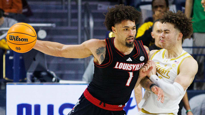 Notre Dame guard Braeden Shrewsberry, center, guards Louisville guard J'Vonne Hadley (1) during a NCAA men's basketball game between Notre Dame and Louisville at Purcell Pavilion on Sunday, Feb. 16, 2025, in South Bend.