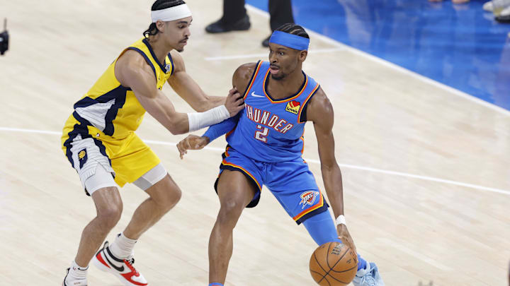 Jun 22, 2025; Oklahoma City, Oklahoma, USA; Oklahoma City Thunder guard Shai Gilgeous-Alexander (2) controls the ball againstIndiana Pacers guard Andrew Nembhard (2) during the first half of game seven of the 2025 NBA Finals at Paycom Center. Mandatory Credit: Alonzo Adams-Imagn Images Jun 22, 2025; Oklahoma City, Oklahoma, USA; Oklahoma City Thunder guard Shai Gilgeous-Alexander (2) controls the ball againstIndiana Pacers guard Andrew Nembhard (2) during the first half of game seven of the 2025 NBA Finals at Paycom Center. Mandatory Credit: Alonzo Adams-Imagn Images