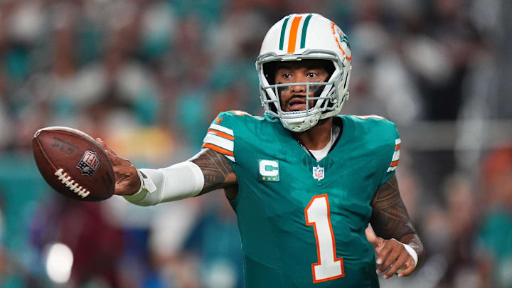 Miami Dolphins quarterback Tua Tagovailoa passes the ball during a game.
