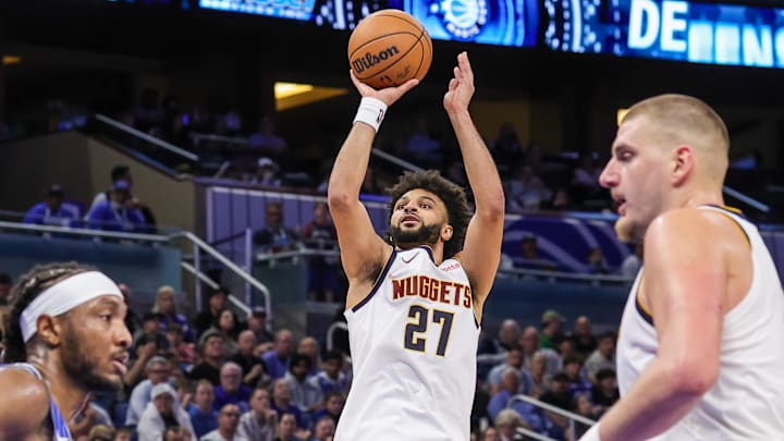 Dec 27, 2025; Orlando, Florida, USA; Denver Nuggets guard Jamal Murray (27) shoots during the second half against the Orlando Magic at Kia Center.