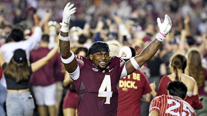 Nov 25, 2022; Tallahassee, Florida, USA; Florida State Seminoles linebacker Kalen DeLoach (4) celebrates as the fans storm the field after defeating the Florida Gators at Doak S. Campbell Stadium. Mandatory Credit: Melina Myers-Imagn Images