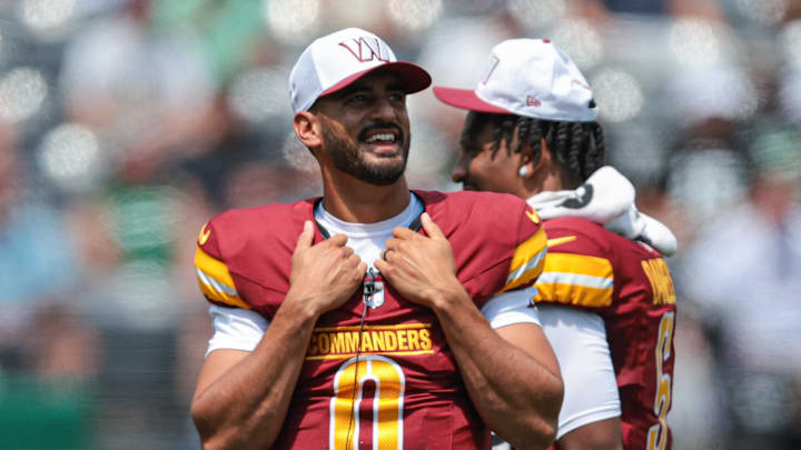 Aug 10, 2024; East Rutherford, New Jersey, USA; Washington Commanders quarterback Marcus Mariota (0) looks on during the first half against the New York Jets at MetLife Stadium. Mandatory Credit: Vincent Carchietta-Imagn Images