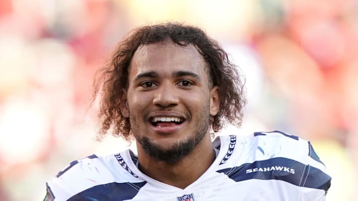 Seattle Seahawks running back Travis Homer walks off the field