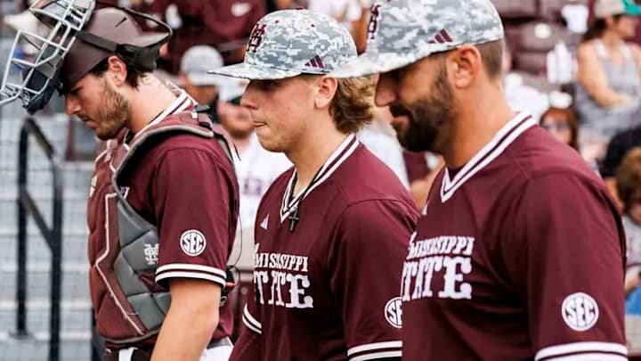 Mississippi State Catcher Kevin Milewski (#21), Mississippi State Pitcher Tomas Valincius (#4) and Mississippi State Assistant Coach Justin Parker during the game between the LSU Tigers and the Mississippi State Bulldogs at Dudy Noble Field at Polk-Dement Stadium in Starkville, MS.