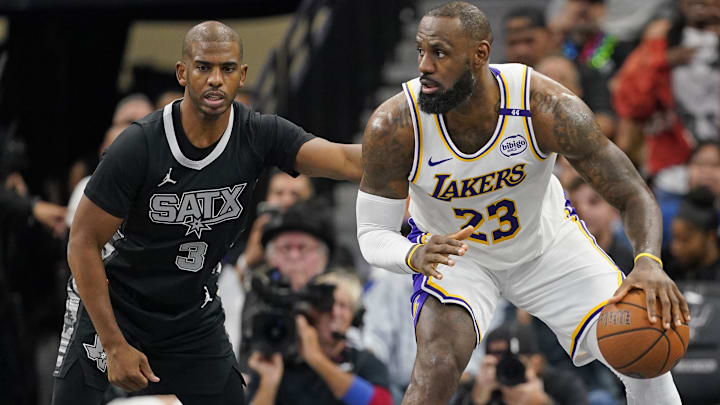 Nov 15, 2024; San Antonio, Texas, USA; Los Angeles Lakers forward LeBron James (23) looks to pass the ball while defended by San Antonio Spurs guard Chris Paul (3) during the first half during the first half at Frost Bank Center. Mandatory Credit: Scott Wachter-Imagn Images Nov 15, 2024; San Antonio, Texas, USA; Los Angeles Lakers forward LeBron James (23) looks to pass the ball while defended by San Antonio Spurs guard Chris Paul (3) during the first half during the first half at Frost Bank Center. Mandatory Credit: Scott Wachter-Imagn Images