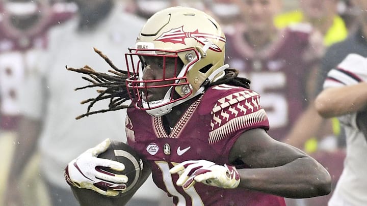 Aug 27, 2022; Tallahassee, Florida, USA; Florida State Seminoles wide receiver Sam McCall (11) runs the ball against Duquesne Dukes defensive back CJ Barnes (13) during the first half at Doak S. Campbell Stadium. Mandatory Credit: Melina Myers-Imagn Images Aug 27, 2022; Tallahassee, Florida, USA; Florida State Seminoles wide receiver Sam McCall (11) runs the ball against Duquesne Dukes defensive back CJ Barnes (13) during the first half at Doak S. Campbell Stadium. Mandatory Credit: Melina Myers-Imagn Images