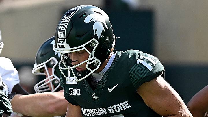 Sep 12, 2026; East Lansing, Michigan, USA; Michigan State Spartans quarterback Alessio Milivojevic (11) moves in the backfield against the Eastern Michigan Eagles during the first quarter at Spartan Stadium. Mandatory Credit: Dale Young-Imagn Images Sep 12, 2026; East Lansing, Michigan, USA; Michigan State Spartans quarterback Alessio Milivojevic (11) moves in the backfield against the Eastern Michigan Eagles during the first quarter at Spartan Stadium. Mandatory Credit: Dale Young-Imagn Images