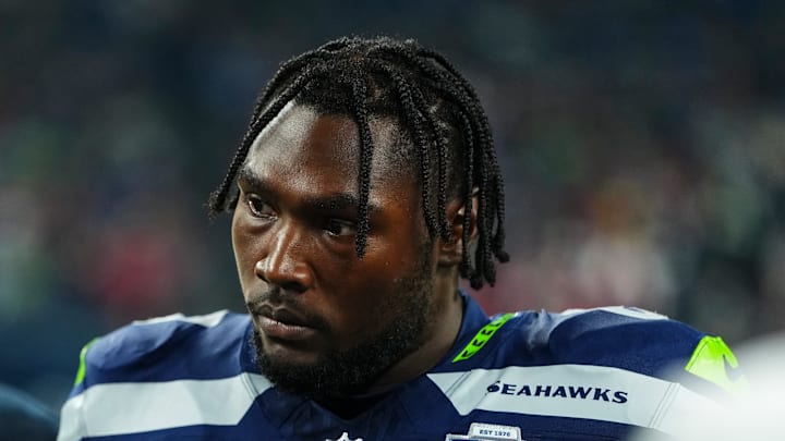 Charles Cross of the Seattle Seahawks watches play Charles Cross of the Seattle Seahawks watches play