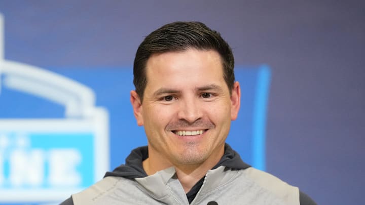 Seattle Seahawks coach Mike Macdonald smiles