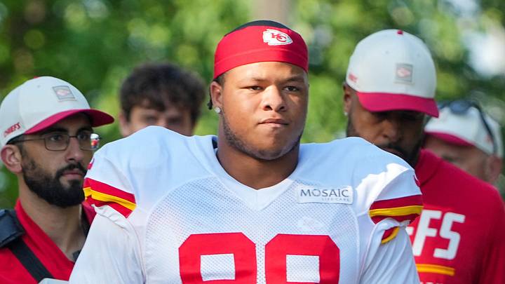 Aug 3, 2026; Kansas City, MO, USA; Kansas City Chiefs   defensive end Felix Anudike-Uzomah (91) and defensive lineman Peter Woods (99) walk down the hill to the fields prior to training camp at Missouri Western University. Mandatory Credit: Denny Medley-Imagn Images