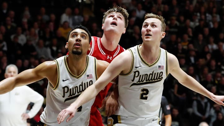 Purdue Boilermakers forward Trey Kaufman-Renn (4) and guard Fletcher Loyer (2) box out