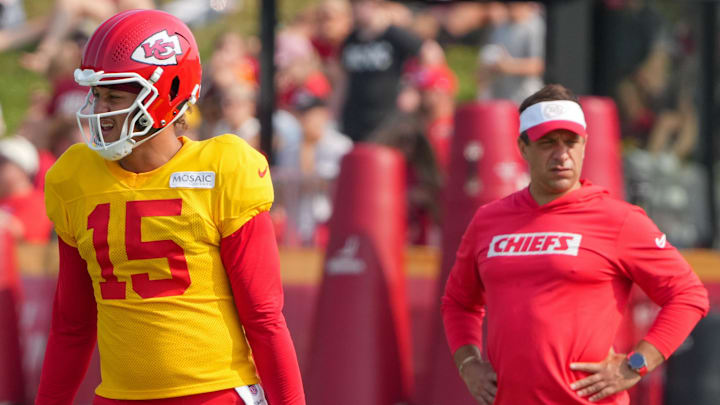 Jul 26, 2024; Kansas City, MO, USA; Kansas City Chiefs quarterback Patrick Mahomes (15) steps to the line as general manager Brett Veach watches in the background during training camp at Missouri Western State University. Mandatory Credit: Denny Medley-Imagn Images