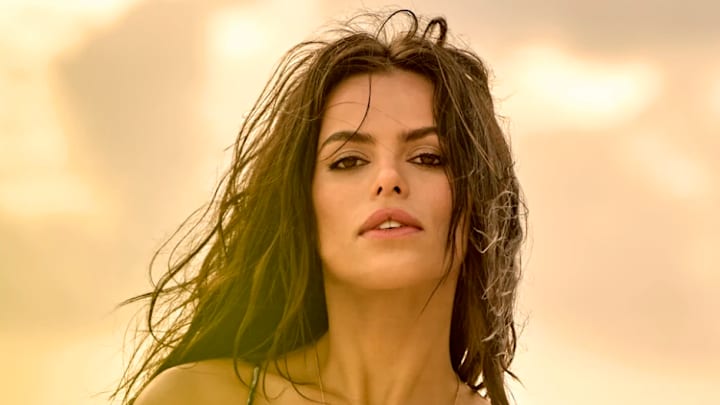 Brooks Nader was photographed by Yu Tsai in Mexico. Swimsuit by Andi Bagus. Body chain by Jacquie Aiche.