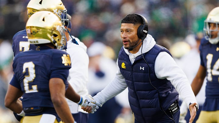 Notre Dame head coach Marcus Freeman celebrates after a touchdown in the first half of a NCAA football game against Syracuse at Notre Dame Stadium. Notre Dame head coach Marcus Freeman celebrates after a touchdown in the first half of a NCAA football game against Syracuse at Notre Dame Stadium.