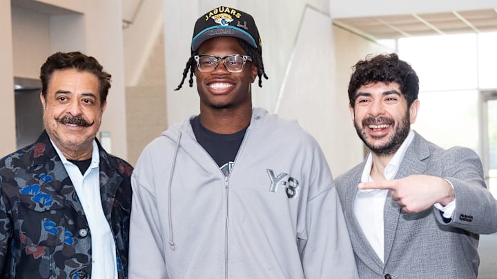 The Jacksonville Jaguars first-round pick, Colorado Buffaloes wide receiver and defensive back Travis Hunter, center, was greeted by Jaguars owner Shahid Khan, left, and his son Tony Khan, right, after Hunter arrived on Friday, March 25, 2025 at Miller Electric Center in Jacksonville, Fla. The team traded up from fifth to second after making a deal with the Cleveland Browns on Thursday night. [Doug Engle/Florida Times-Union]