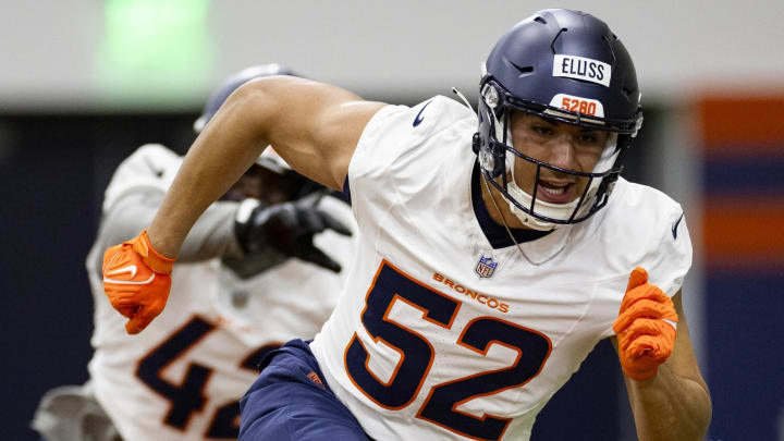 Denver Broncos rookie outside linebacker Jonah Ellis (52) rushing during rookie minicamp. 