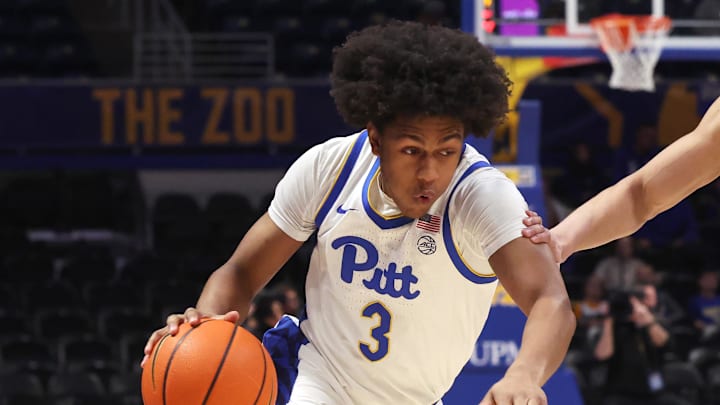 Jan 27, 2026; Pittsburgh, Pennsylvania, USA;  Pittsburgh Panthers guard Brandin Cummings (3) drives to the basket against Wake Forest Demon Deacons guard Nate Calmese (1) during the first half at the Petersen Events Center. Mandatory Credit: Charles LeClaire-Imagn Images
