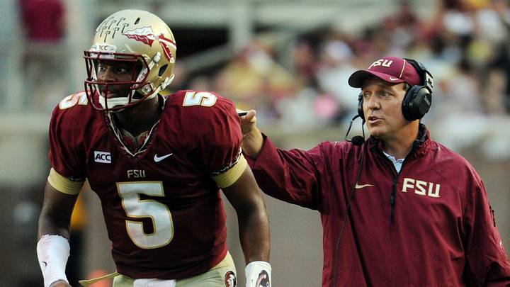 Sep 21, 2013; Tallahassee, FL, USA; Florida State Seminoles quarterback Jameis Winston (5) returns to the field after talking with head coach Jimbo Fisher during the first half of the game against the Bethune-Cookman Wildcats at Doak Campbell Stadium. Mandatory Credit: Melina Vastola-USA TODAY Sports