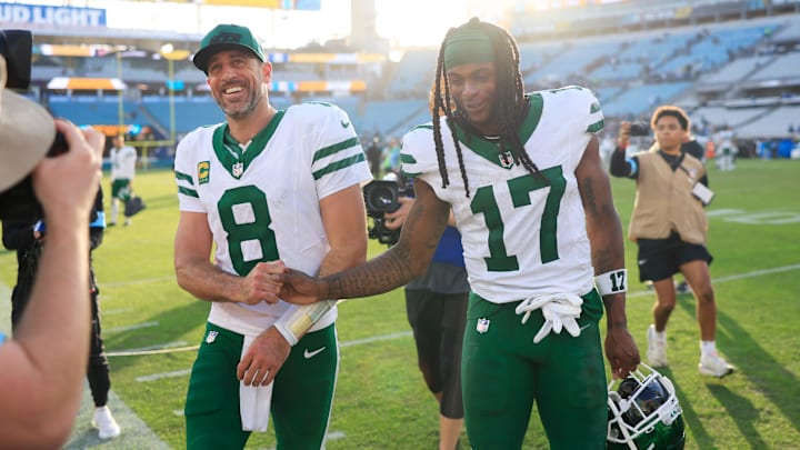 New York Jets quarterback Aaron Rodgers (8) and wide receiver Davante Adams (17) high-five each other as they walks off the field after the game Sunday, Dec. 15, 2024 at EverBank Stadium in Jacksonville, Fla. The Jets held off the Jaguars 32-25. [Corey Perrine/Florida Times-Union]