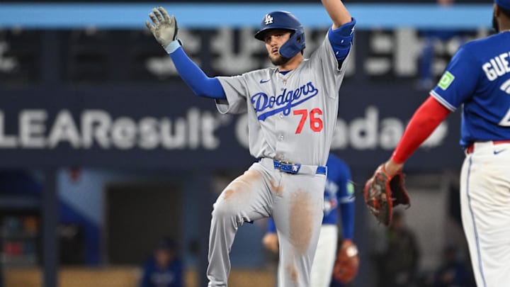 Apr 7, 2026; Toronto, Ontario, CAN;  Los Angeles Dodgers second baseman Alex Freeland (76) reacts after hitting a double against the Toronto Blue Jays in the seventh inning at Rogers Centre. Mandatory Credit: Dan Hamilton-Imagn Images