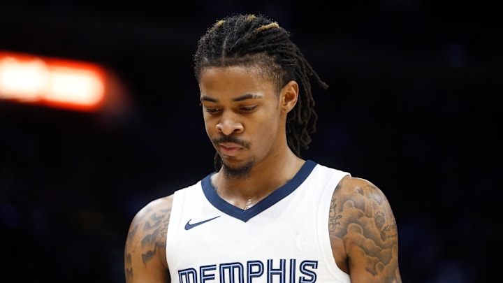 Dec 31, 2023; Memphis, Tennessee, USA; Memphis Grizzlies guard Ja Morant (12) reacts during the second half against the Sacramento Kings at FedExForum.