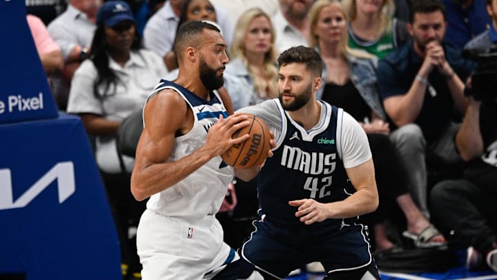 May 28, 2024; Dallas, Texas, USA; Minnesota Timberwolves center Rudy Gobert (27) dribbles against Dallas Mavericks forward Maxi Kleber (42) during the second quarter of game four of the Western Conference finals for the 2024 NBA playoffs at American Airlines Center. Mandatory Credit: Jerome Miron-Imagn Images May 28, 2024; Dallas, Texas, USA; Minnesota Timberwolves center Rudy Gobert (27) dribbles against Dallas Mavericks forward Maxi Kleber (42) during the second quarter of game four of the Western Conference finals for the 2024 NBA playoffs at American Airlines Center. Mandatory Credit: Jerome Miron-Imagn Images